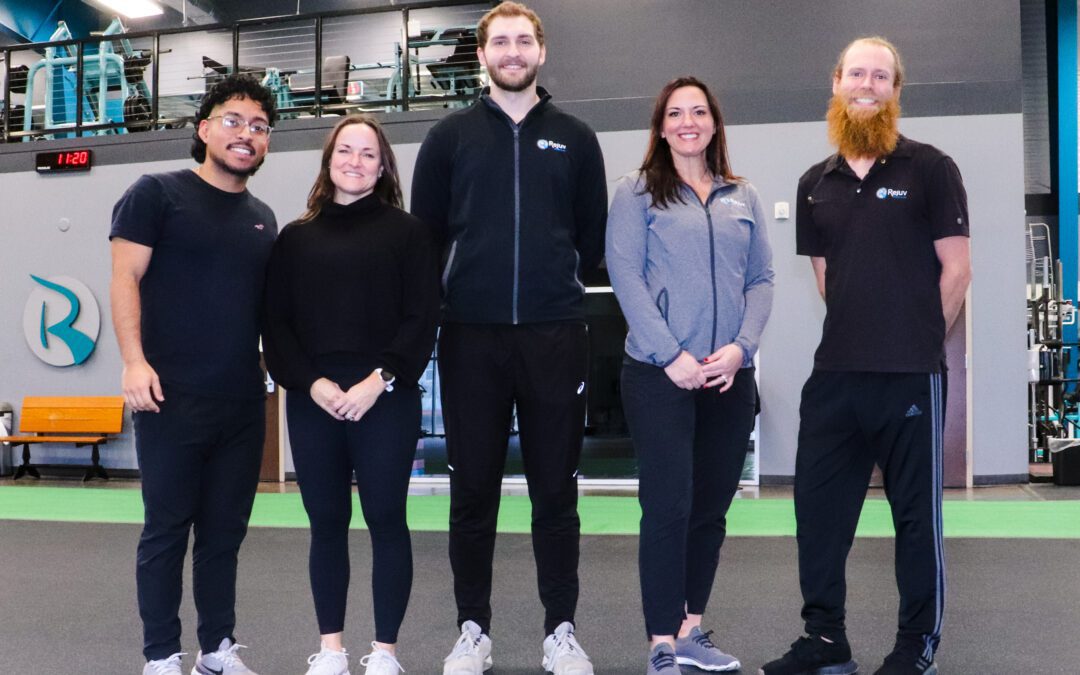 a group of personal trainers in a gym